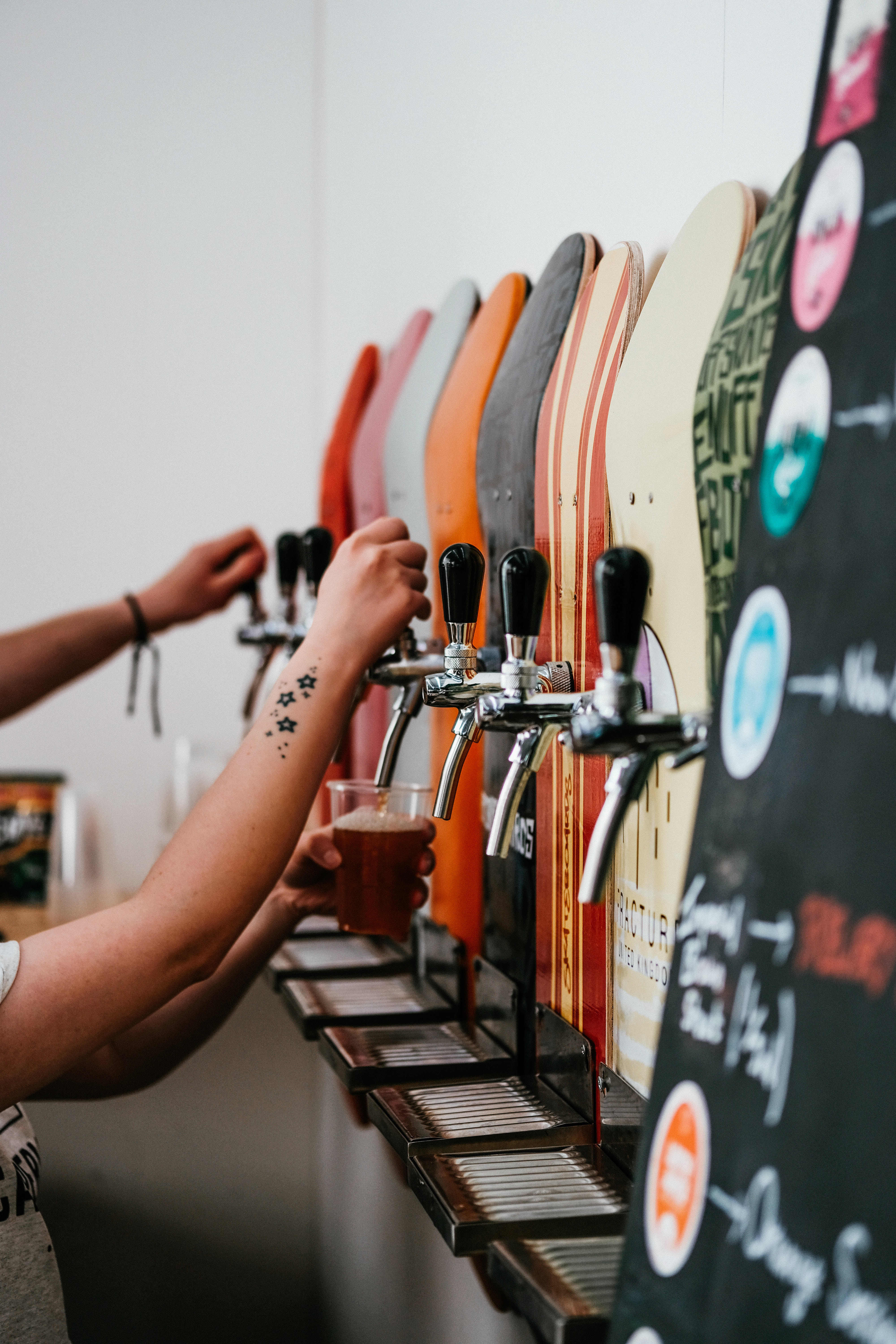 Pint of beer being poured from a tap