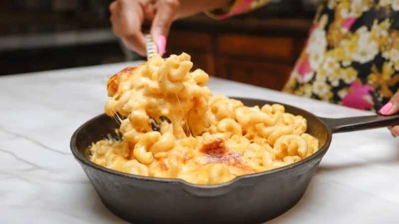 Delicious baked mac and cheese with a golden, crispy top, perfect for a soulful Thanksgiving feast.