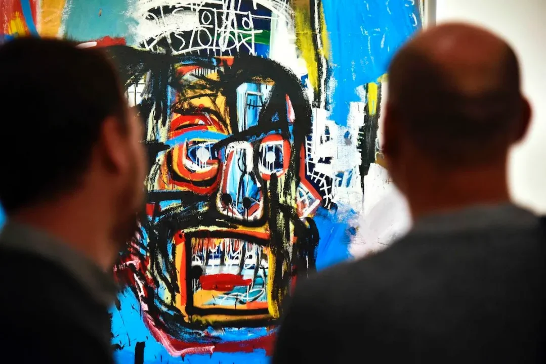 Museum patrons viewing a Jean-Michel Basquiat piece &mdash; one of the most influential figures in hip-hop art history