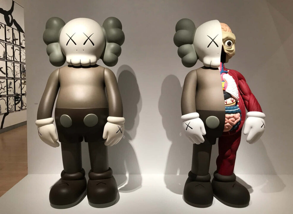 Two large-scale KAWS Companion sculptures in a gallery &mdash; an example of hip-hop art's influence on contemporary fine art and collectible culture